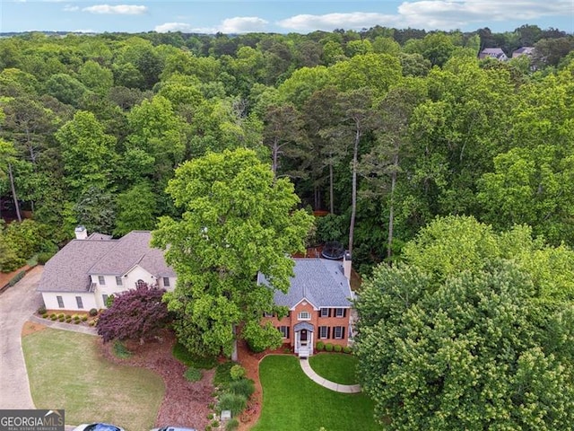 view of subject property featuring a forest
