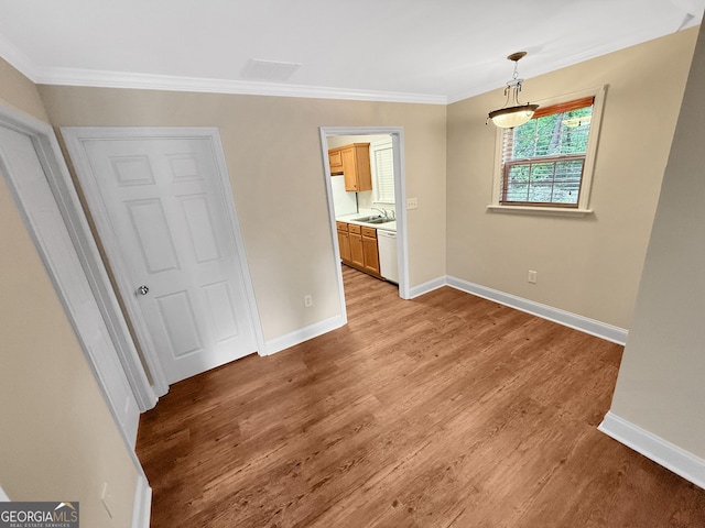 445 Logmont Trce, Athens, GA 30606 - unfurnished bedroom featuring crown molding, baseboards, light wood-style floors, a sink, and ensuite bathroom
