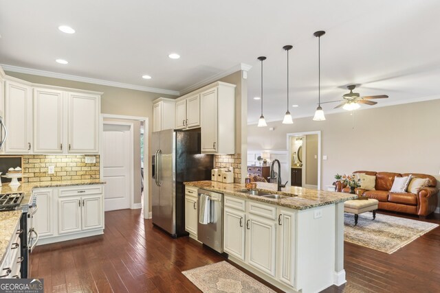 59 Grand Georgian Ct NE, Cartersville, GA 30121 - kitchen with stainless steel appliances, a ceiling fan, decorative backsplash, a peninsula, and open floor plan