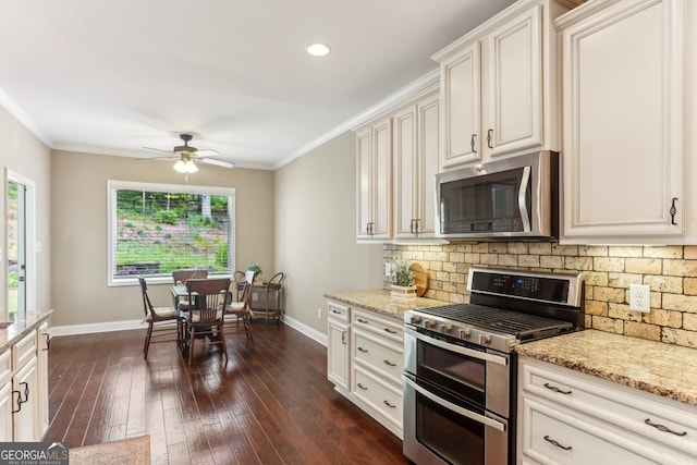 59 Grand Georgian Ct NE, Cartersville, GA 30121 - kitchen with appliances with stainless steel finishes, decorative backsplash, crown molding, light stone counters, and recessed lighting