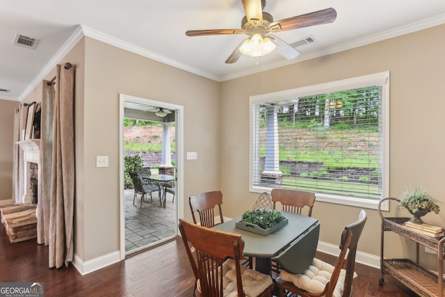 59 Grand Georgian Ct NE, Cartersville, GA 30121 - dining area with a ceiling fan, crown molding, dark wood-style floors, and a fireplace