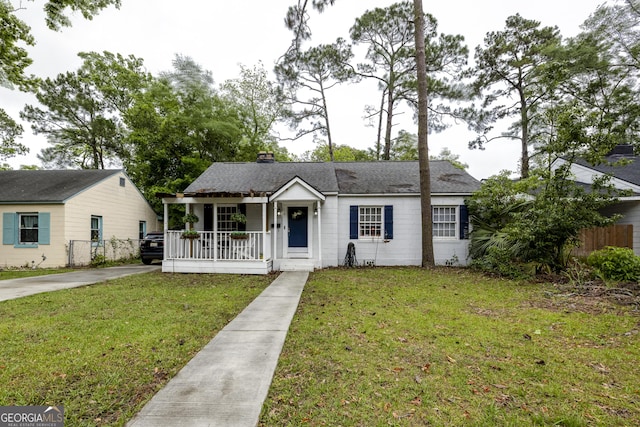 6 Oleander Ave, Savannah, GA 31404 - view of front of home featuring a porch, a chimney, and a shingled roof