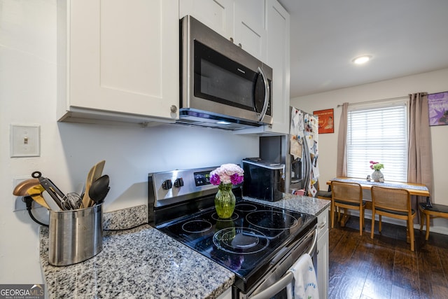 6 Oleander Ave, Savannah, GA 31404 - kitchen with stainless steel appliances, white cabinetry, light stone countertops, dark wood finished floors, and recessed lighting