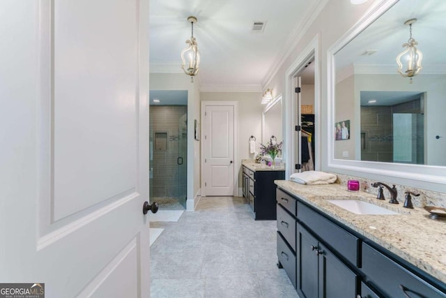 full bath featuring a stall shower, vanity, a chandelier, ornamental molding, and a walk in closet