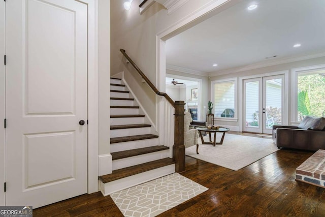 stairway with wood finished floors, crown molding, french doors, recessed lighting, and ceiling fan