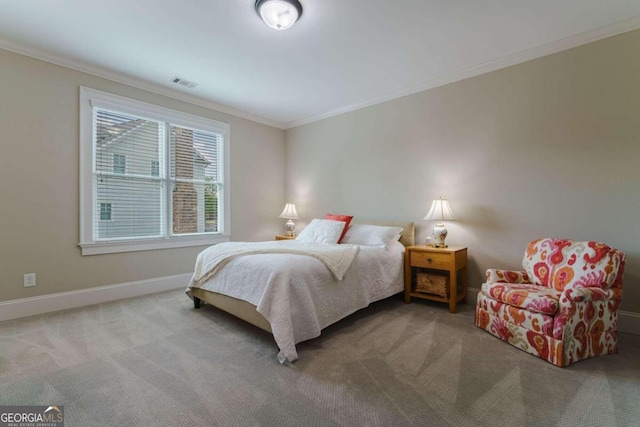 bedroom featuring carpet, crown molding, and baseboards