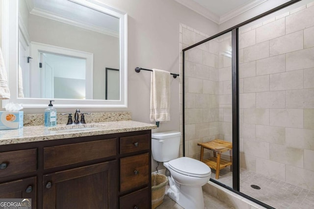 full bathroom featuring a shower stall, toilet, vanity, and crown molding
