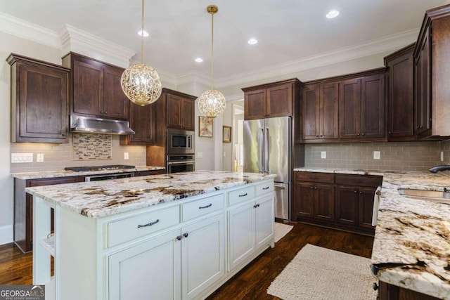 kitchen featuring appliances with stainless steel finishes, under cabinet range hood, a sink, dark wood-type flooring, and a center island