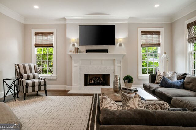 1849 Rock Springs Ln NE, Atlanta, GA 30324 - living area with crown molding, a fireplace, baseboards, recessed lighting, and wood finished floors