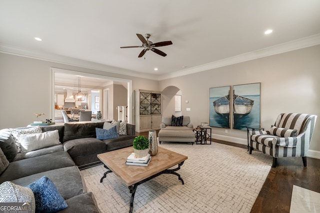 1849 Rock Springs Ln NE, Atlanta, GA 30324 - living area with arched walkways, light wood-style flooring, a ceiling fan, recessed lighting, and crown molding