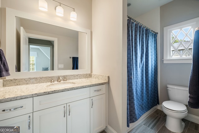 1849 Rock Springs Ln NE, Atlanta, GA 30324 - full bath with vanity, toilet, baseboards, and curtained shower