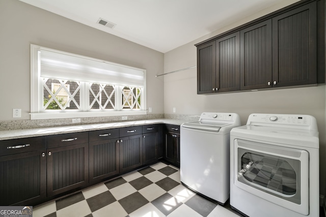 1849 Rock Springs Ln NE, Atlanta, GA 30324 - laundry room featuring cabinet space, light floors, and washer and clothes dryer