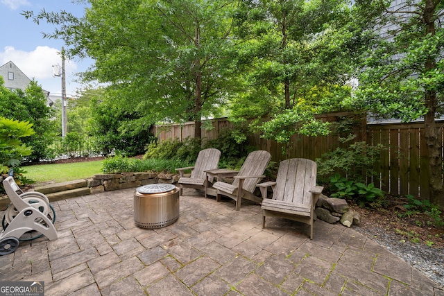 1849 Rock Springs Ln NE, Atlanta, GA 30324 - view of patio featuring fence and a fire pit