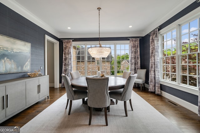 1849 Rock Springs Ln NE, Atlanta, GA 30324 - dining space featuring plenty of natural light, a chandelier, ornamental molding, baseboards, and dark wood-type flooring