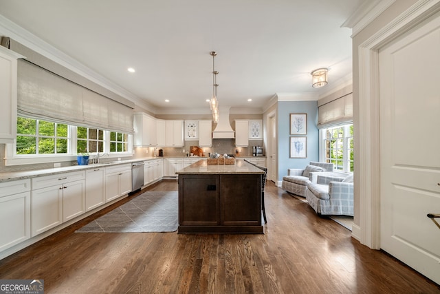 1849 Rock Springs Ln NE, Atlanta, GA 30324 - kitchen featuring plenty of natural light, dishwasher, white cabinetry, dark wood finished floors, and ornamental molding