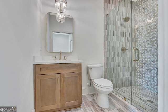 126 Morgan St, Senoia, GA 30276 - bathroom featuring toilet, a shower stall, vanity, wood finished floors, and baseboards