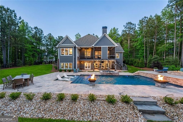 116 Serenity Lake Dr, Alpharetta, GA 30004 - rear view of house featuring a fire pit, stairs, a patio area, a chimney, and a lawn