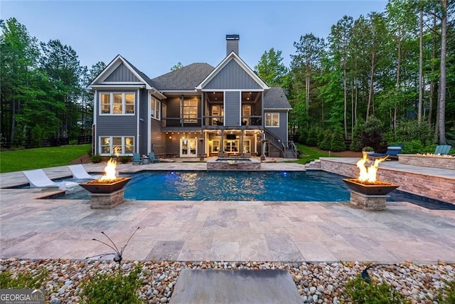 116 Serenity Lake Dr, Alpharetta, GA 30004 - rear view of house with a fire pit, stairway, an outdoor pool, and a patio area