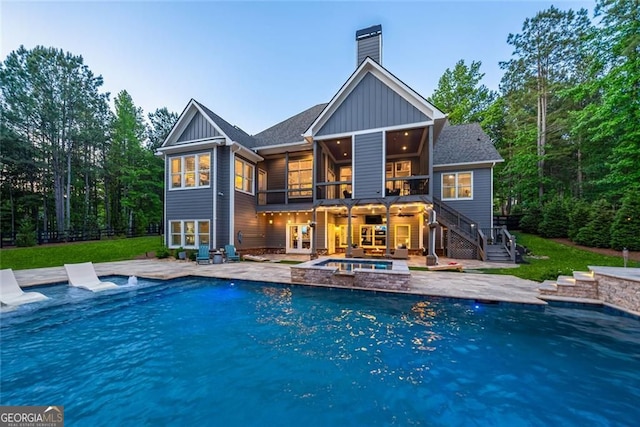 116 Serenity Lake Dr, Alpharetta, GA 30004 - back of house with stairway, board and batten siding, a ceiling fan, a patio area, and a chimney