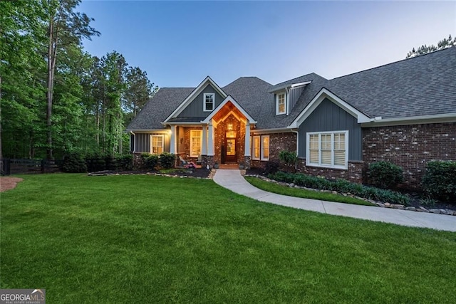 116 Serenity Lake Dr, Alpharetta, GA 30004 - craftsman inspired home with brick siding, a front lawn, board and batten siding, and roof with shingles