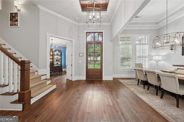 116 Serenity Lake Dr, Alpharetta, GA 30004 - foyer entrance featuring a chandelier, wood finished floors, stairs, ornamental molding, and a towering ceiling