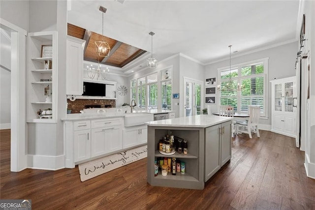 116 Serenity Lake Dr, Alpharetta, GA 30004 - kitchen with a sink, open shelves, dark wood-style floors, light countertops, and a center island