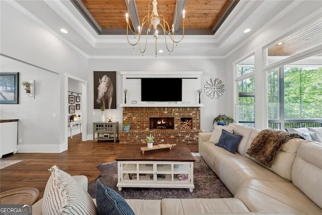 116 Serenity Lake Dr, Alpharetta, GA 30004 - living area with a raised ceiling, wooden ceiling, wood finished floors, baseboards, and a chandelier