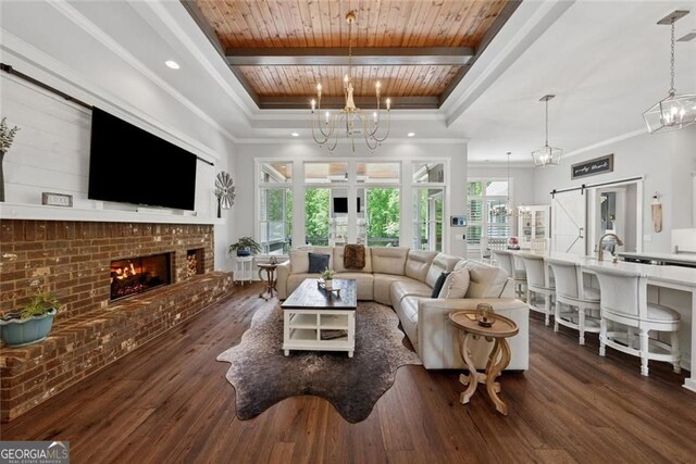 116 Serenity Lake Dr, Alpharetta, GA 30004 - living room featuring a chandelier, a fireplace, wood finished floors, wood ceiling with exposed beams, and recessed lighting