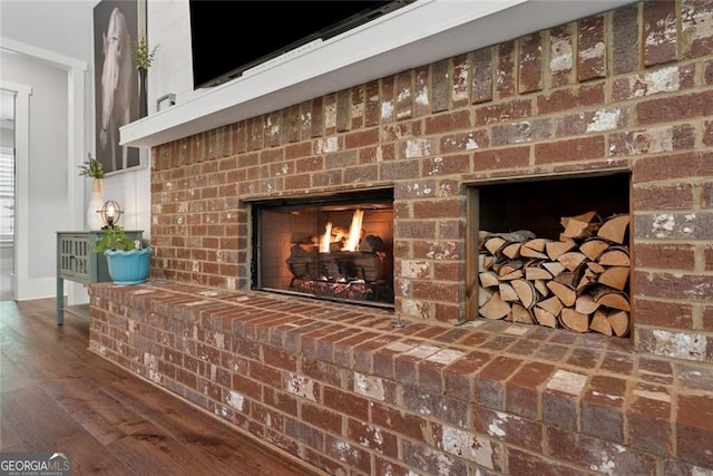 116 Serenity Lake Dr, Alpharetta, GA 30004 - detailed view of a fireplace, wood finished floors, and baseboards