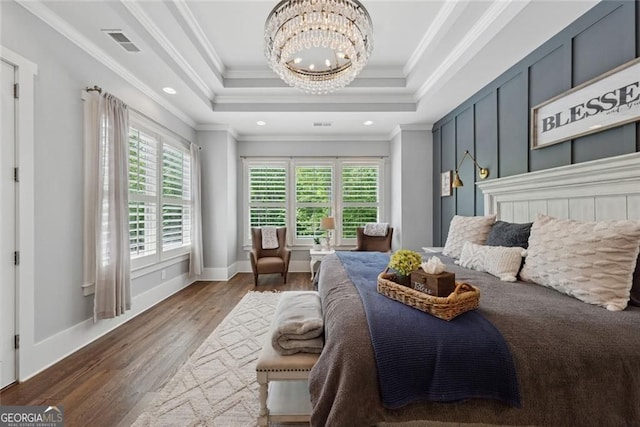 116 Serenity Lake Dr, Alpharetta, GA 30004 - bedroom with a chandelier, wood finished floors, ornamental molding, a tray ceiling, and baseboards
