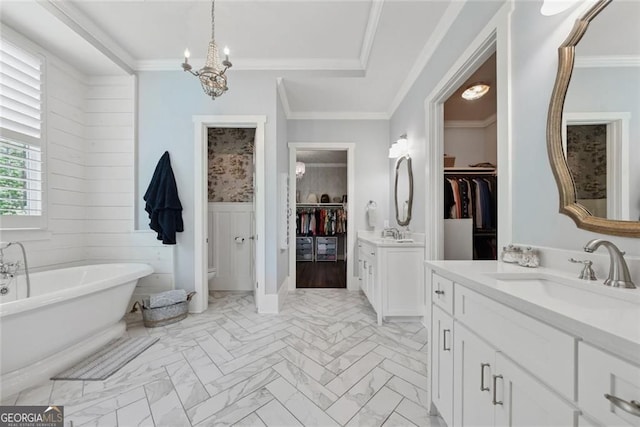 116 Serenity Lake Dr, Alpharetta, GA 30004 - full bath with two vanities, a walk in closet, a freestanding tub, a chandelier, and marble finish flooring