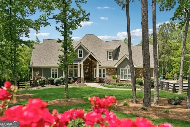 116 Serenity Lake Dr, Alpharetta, GA 30004 - craftsman-style house featuring brick siding, a shingled roof, and board and batten siding