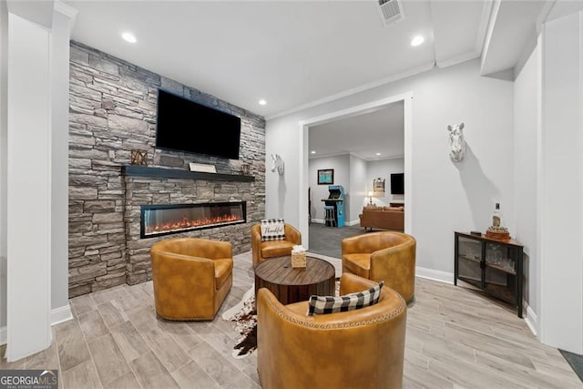 116 Serenity Lake Dr, Alpharetta, GA 30004 - living area with a stone fireplace, wood finished floors, baseboards, crown molding, and recessed lighting