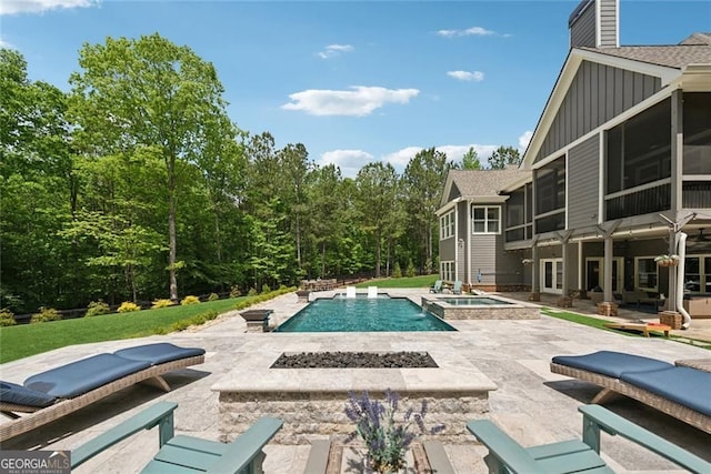 116 Serenity Lake Dr, Alpharetta, GA 30004 - view of pool with a sunroom, a patio area, an outdoor fire pit, and a pool with connected hot tub