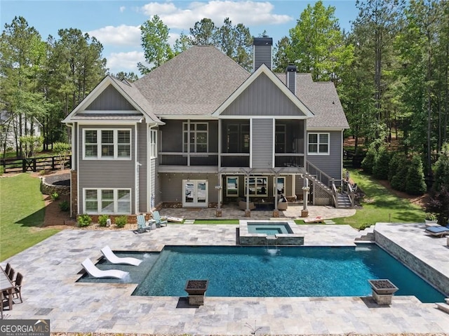 116 Serenity Lake Dr, Alpharetta, GA 30004 - rear view of house with a sunroom, a chimney, a patio area, and board and batten siding