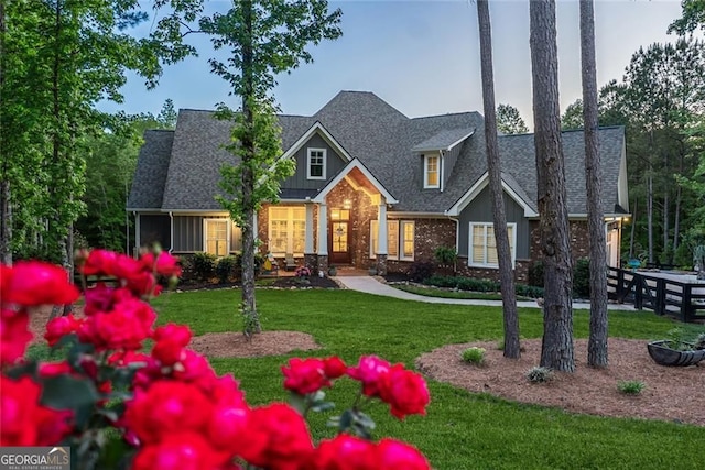 116 Serenity Lake Dr, Alpharetta, GA 30004 - craftsman house with brick siding, a front lawn, roof with shingles, and board and batten siding