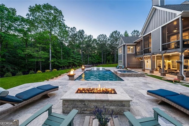 116 Serenity Lake Dr, Alpharetta, GA 30004 - view of swimming pool featuring a fire pit, a patio, a sunroom, and a pool with connected hot tub