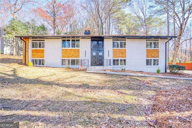2541 Peyton Woods Trl SW, Atlanta, GA 30311 - back of house with brick siding and a chimney