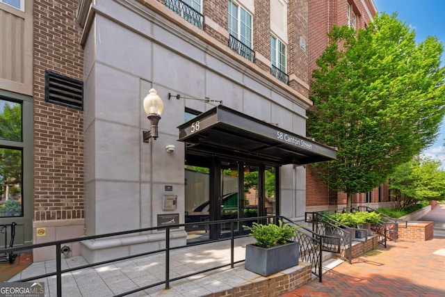 58 Canton St Unit 404, Alpharetta, GA 30009 - doorway to property featuring brick siding and french doors