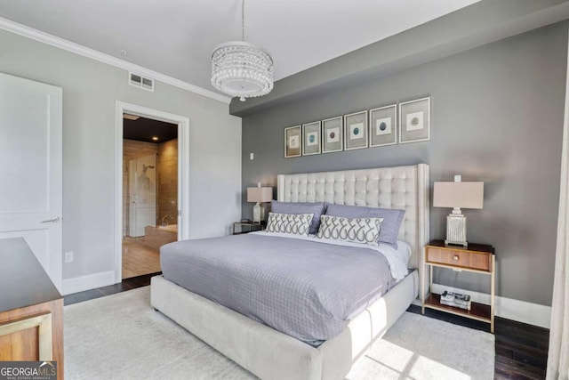 58 Canton St Unit 404, Alpharetta, GA 30009 - bedroom featuring baseboards, crown molding, wood finished floors, and ensuite bathroom