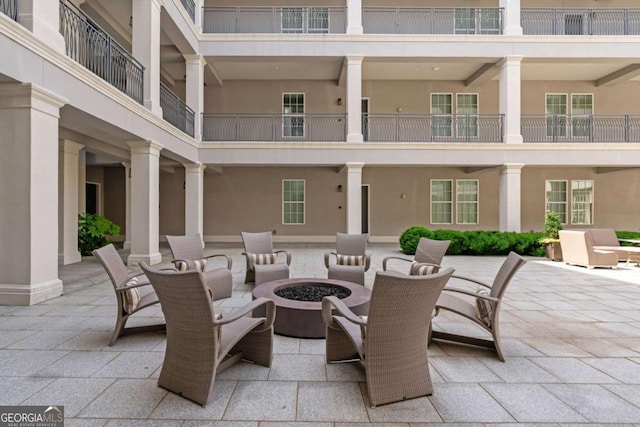 view of patio / terrace featuring a fire pit