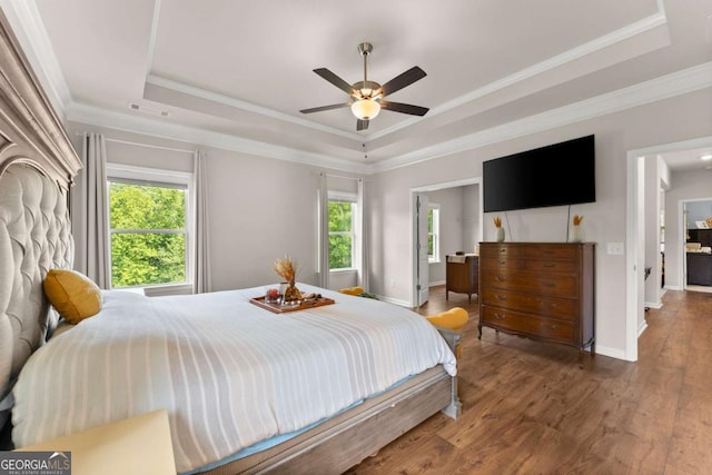 3616 Castoff Ct, Gainesville, GA 30506 - bedroom with a tray ceiling, wood finished floors, baseboards, crown molding, and a ceiling fan