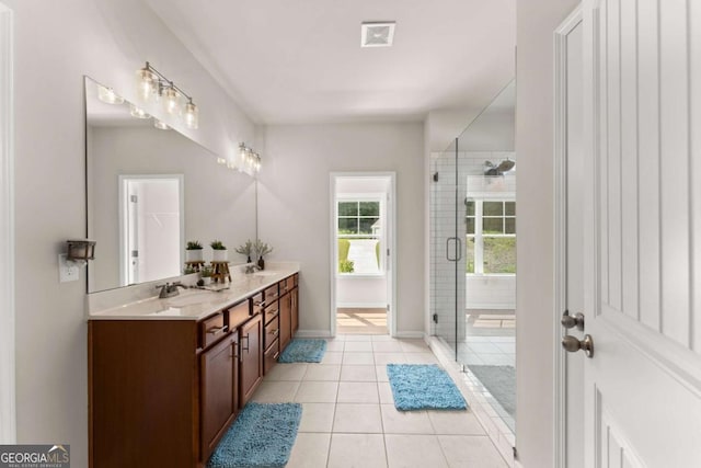 3616 Castoff Ct, Gainesville, GA 30506 - bathroom with a stall shower, double vanity, tile patterned flooring, and baseboards