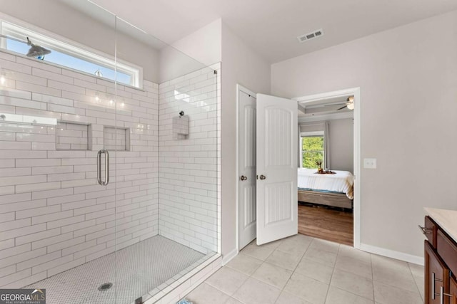 3616 Castoff Ct, Gainesville, GA 30506 - bathroom featuring a stall shower, connected bathroom, vanity, tile patterned flooring, and a ceiling fan
