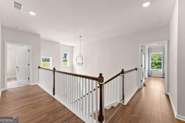 3616 Castoff Ct, Gainesville, GA 30506 - hallway with hardwood / wood-style flooring, an upstairs landing, baseboards, recessed lighting, and a chandelier