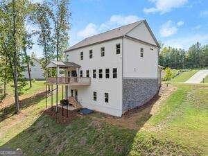 3616 Castoff Ct, Gainesville, GA 30506 - rear view of property with a lawn, stucco siding, and a deck