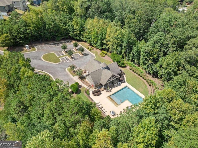3616 Castoff Ct, Gainesville, GA 30506 - aerial view of property and surrounding area with a pool area and a heavily wooded area