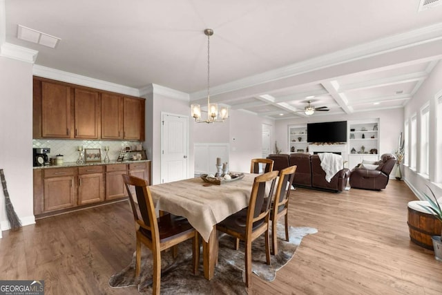3616 Castoff Ct, Gainesville, GA 30506 - dining space with ceiling fan, wood finished floors, beamed ceiling, a chandelier, and crown molding
