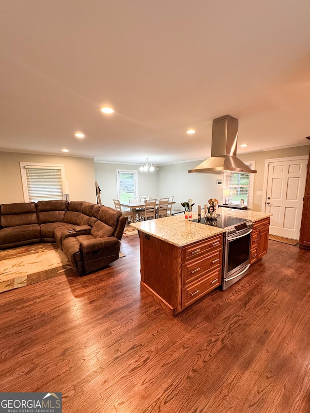 kitchen featuring island range hood, stainless steel electric range oven, dark wood-style floors, brown cabinetry, and recessed lighting