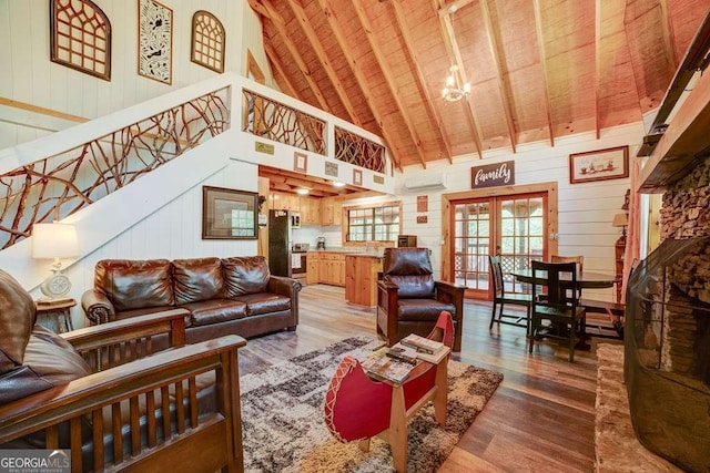 369 Trillium Rd, Suches, GA 30572 - living room featuring wooden ceiling, wood finished floors, high vaulted ceiling, french doors, and wooden walls